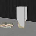 Unique-shaped Table Lamp with Open Book on Light-colored Countertop and Dark Wooden Texture Wall