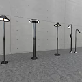 Modern Floor Lamps With Various Designs Metal Stands And Illuminated Shades Against Minimalist Wall