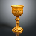 Elegant Golden Goblet With Intricate Carved Patterns And Sturdy Base Design