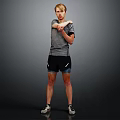 A Man In Gray Short Sleeve Shirt And Black Shorts Stretching Arms On Dark Background