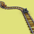 Curved Toy Train Tracks With Small Toy Cars On Yellow Background