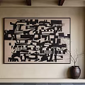 Black And White Abstract Painting On Wall With Ceramic Vase And Twigs