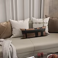 Stylish Decorative Sofa Pillows In Brown White With Black Strap Design On Beige Sofa