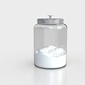 Transparent Glass Condiment Jar With Silver Lid Holding White Powder For Kitchen Use