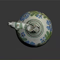 Traditional Ceramic Jug With Green And Blue Floral Patterns And Curved Handle