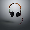 Modern Stylish Headphones With Orange Headband Black Ear Cups And Red Cable