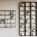 Wall Mounted Dark Gray Shelving Units With Books Potted Plants Decorative Items And Folded Towels