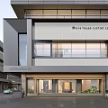 Modern Xenolith Storefront Design with Glass Entrance Brand Signage and Pedestrian Area