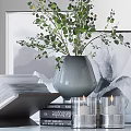 Decorative Ornament Set With Open Book Stacked Books Gray Vase Green Foliage And Framed Artwork