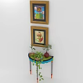 Stylish Console Table With Potted Plants And Framed Wall Art