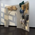 Beige Arched Storefront With Wooden Plaque and Multiple Colored Bows Green Blue Gold Gray Silver