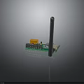 Electronic Green Circuit Board Module With Orange Square Component Blue Chip Long Black Antenna