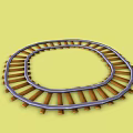 Curved Toy Train Tracks With Small Toy Cars On Yellow Background