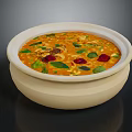Fresh Orange Creamy Soup Topped With Green Herbs And Red Pieces In Ceramic Bowl