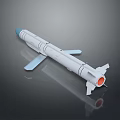 White Military Missile With Blue Nose Cone And Tail Fins On Shiny Surface