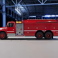 Red Fire Truck Parked In Industrial Warehouse With Metal Structure And Spacious Interior