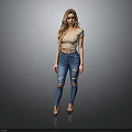 Woman In Beige Cropped Top And Blue Ripped Jeans Standing With Gray Background Reflective Floor