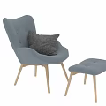 Blue Leisure Chairs With Gray Decorative Pillows And Light Wooden Legs And Ottoman