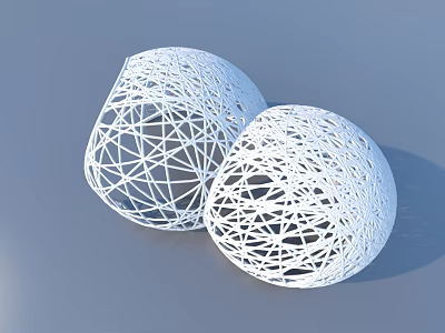 Two White Mesh Spherical Decorative Objects With Geometric Pattern Design 3d model