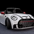 White Mini Convertible Car With Red Side Mirrors And Black Alloy Wheels