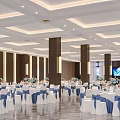 Spacious Banquet Hall Featuring White Tablecloths Blue Ribbons And Flower Centerpieces