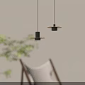 Modern Minimalist Pendant Lights With Black Circular Design Illuminated In Interior Space