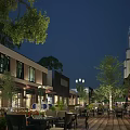 Night View Of Commercial Street With Outdoor Seating Trees And Lighting