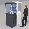 Businessman Observes Modern Commercial Equipment In Display Cabinets With Robotic Arms
