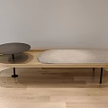 Sleek Modern Coffee Table With Black Metal Wire Frame And Orange Cushioned Top