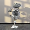 Decorative Floral Art Installation With Pink Roses Green Vase And Shadow Effects