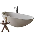 Modern Minimalist Oval Freestanding Bathtub With Wooden Side Table Potted Plant And Scented Candle