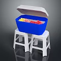 Open Blue Cooler With White Lid On Two White Plastic Stools Containing Colorful Ice
