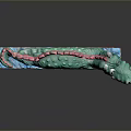 Vibrant Green Dragon Sculpture With Red Accents Lying On Brown Base Artistic