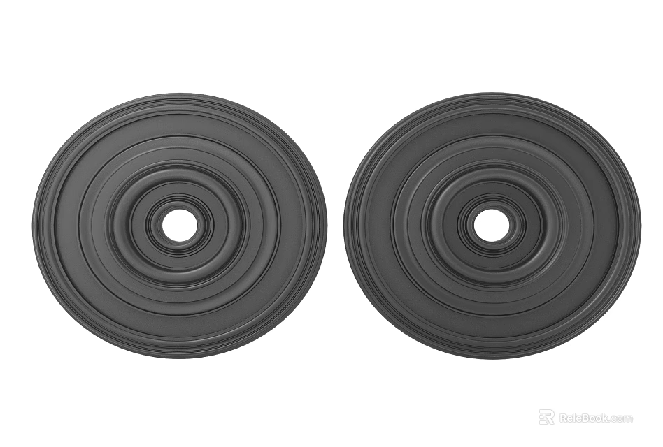 Two Black Circular Carved Decorative Pieces Featuring Concentric Circles And Center Holes 3d model 