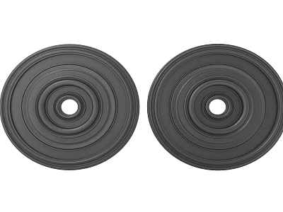 Two Black Circular Carved Decorative Pieces Featuring Concentric Circles And Center Holes 3d model