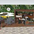 YOLK & CO Outdoor Space With Vintage Bus Wooden Deck Umbrellas Tables Chairs And Green Plant Wall