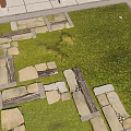 Natural Stone Slab Pathway Winding Through Lush Green Grass In Garden Area