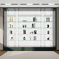 Modern Interior Display Shelf Unit With Glass Shelves Decorative Items Books And Bottles