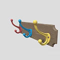 Three Colorful Wall Hooks Mounted On Wooden Board With Red Blue Yellow Design