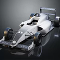 Sleek Silver Single Seater Race Car With Large Rear Wing And Aerodynamic Design