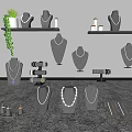 Jewelry Display Setup With Necklace Mannequins Earring Stands Green Plants And Shelves