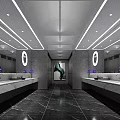 Modern Public Restroom Interior With Marble Vanities Round Mirrors Purple Flowers And Black Marble Floor