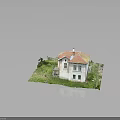Two Story Vintage House Model With Red Roof White Walls And Green Grass