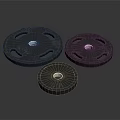 Black Weight Plates In Three Different Sizes For Home Daily Fitness Use