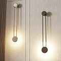 Modern Minimalist Wall Lamps With Gold And Brown Rods Mounted On Textured Wall