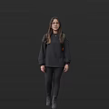 Woman In Dark Sweatshirt And Pants Standing Against Dark Background With Long Hair