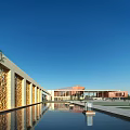 Modern School Building With Carved Walls Red Roof And Water Pool Under Blue Sky