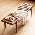 Wooden Striped Bench With White Blanket And Patterned Book On Light Floor