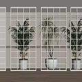 Glass Room Dividers with Various Patterns in Modern Interior Featuring Wooden Floor and Green Plants