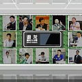 Exhibition Hall Culture Wall with Multiple Person Photos and Central Brand Logo